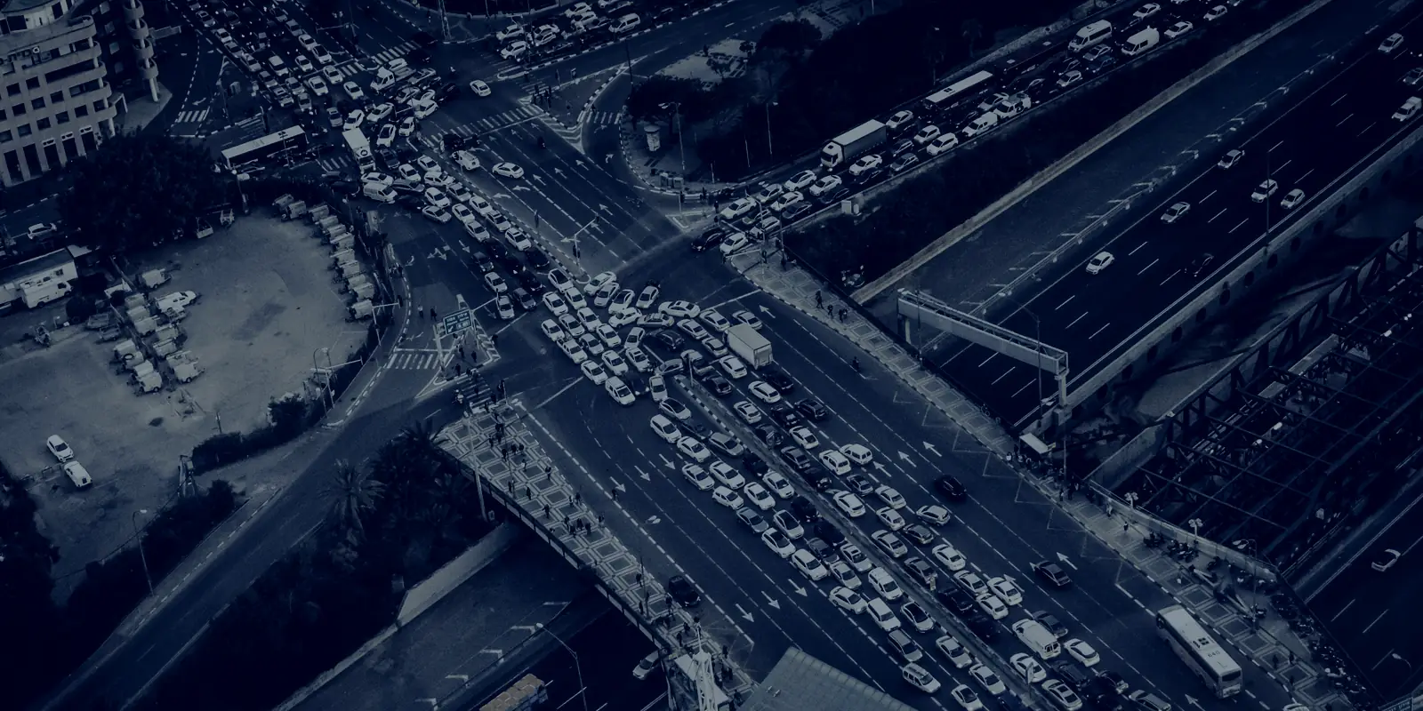 Aerial view of traffic backed up at a city intersection
